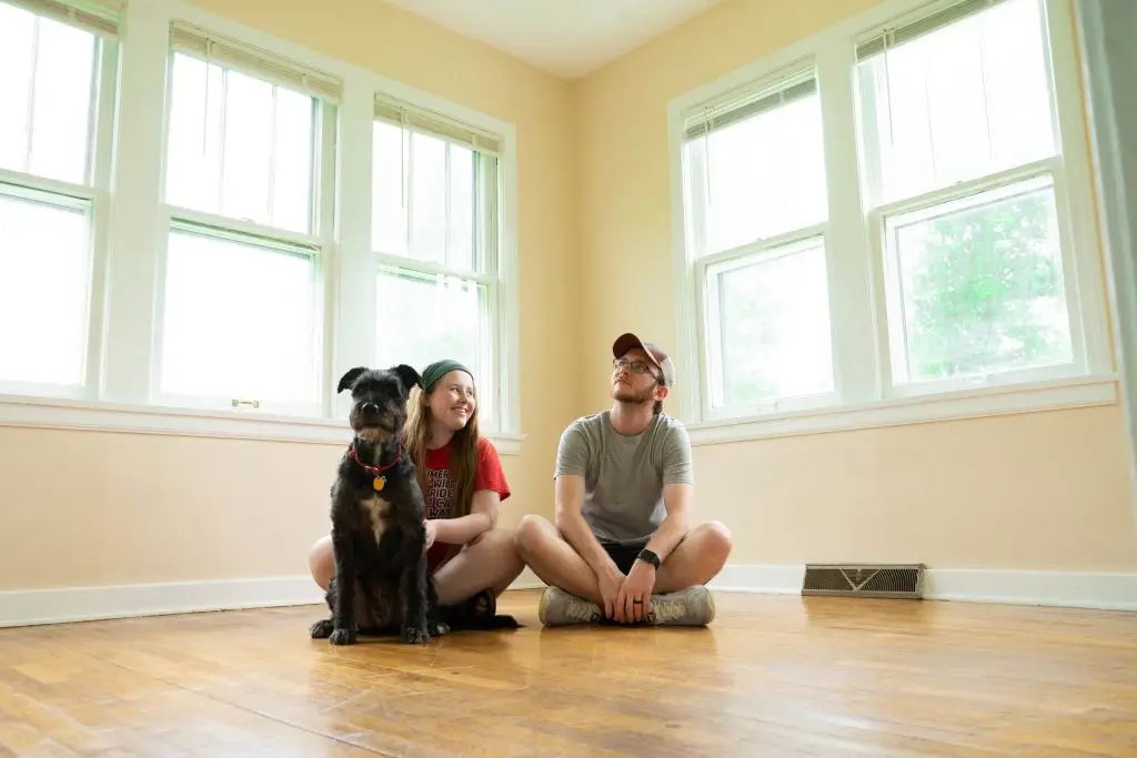 Couple with dog in new home